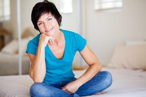 attractive middle aged woman relaxing at home