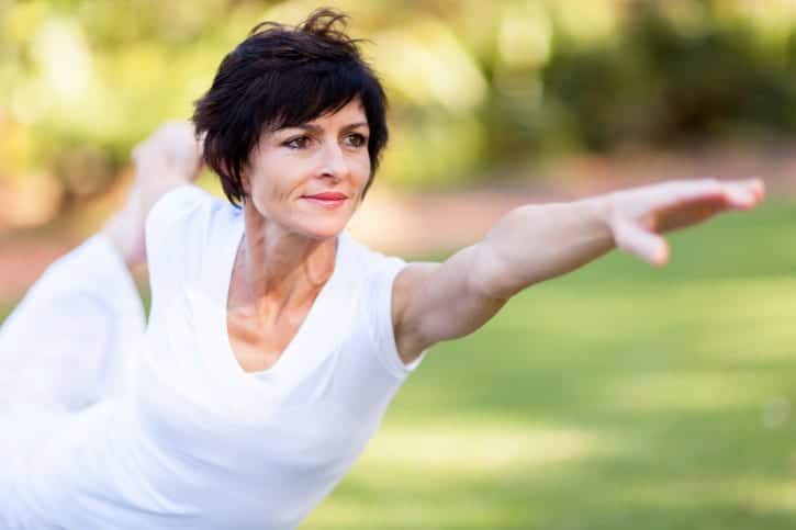 healthy middle aged woman stretching